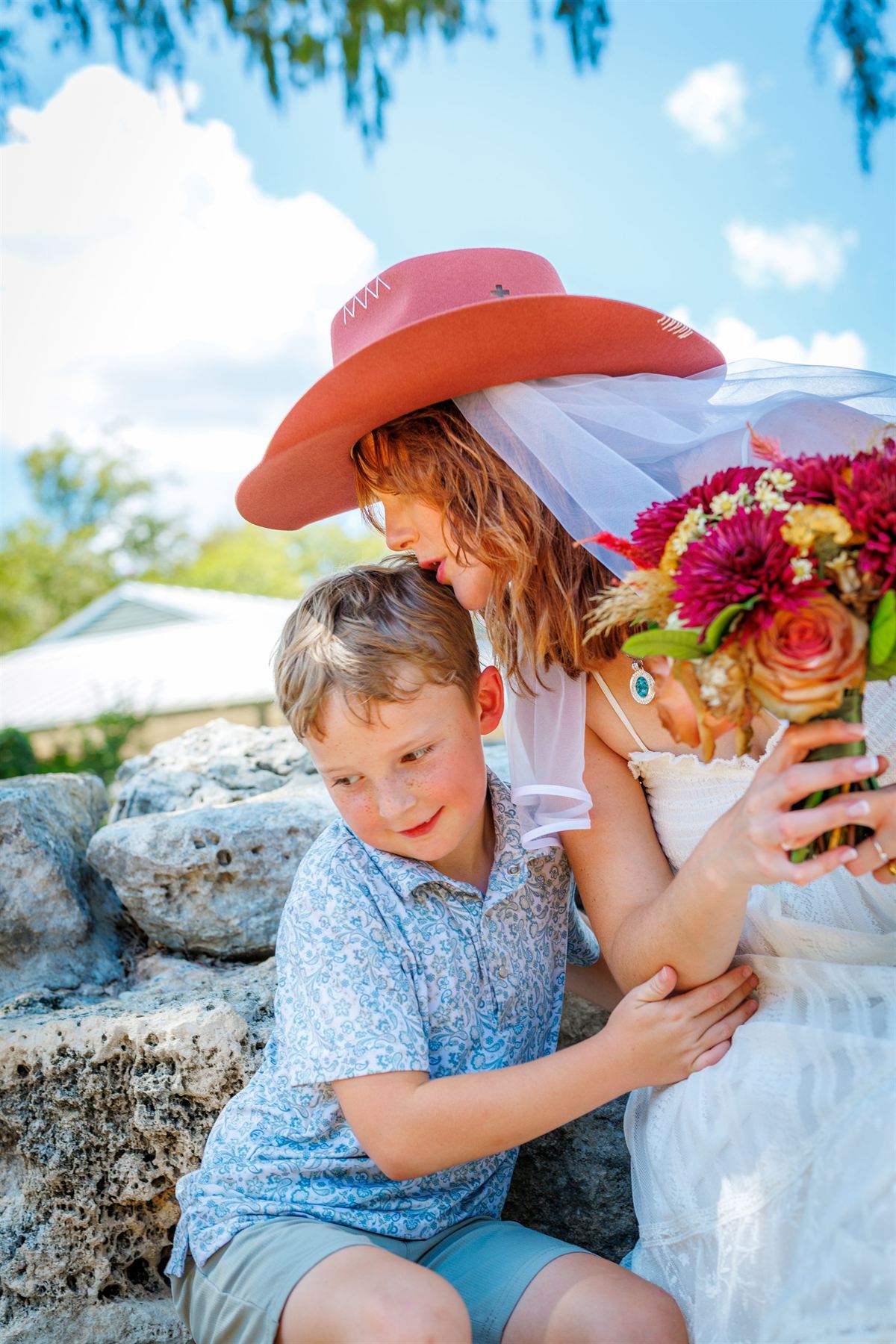The bride hugs a young guest