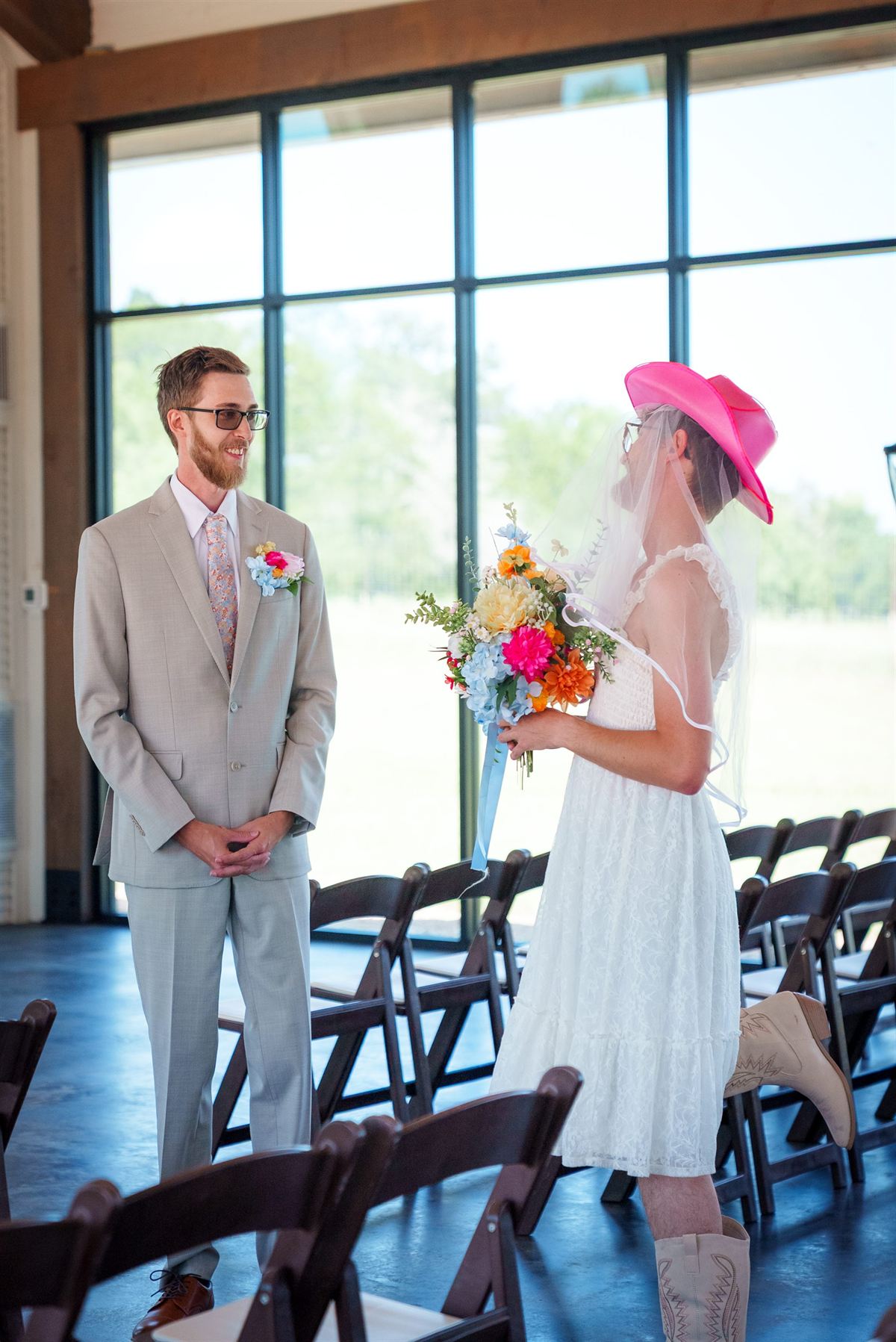 The bride walks toward her groom